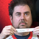 Jeff holding a piece of paper with the number 4 on it.